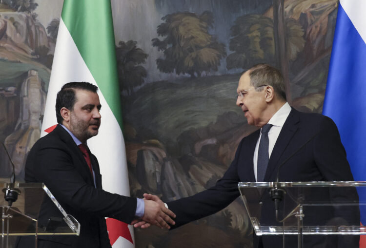 Russian Foreign Minister Sergei Lavrov and Syrian Foreign Minister Asaad al-Shaibani shake hands at the end of a joint press conference following their meeting in Moscow on July 31, 2025. (Photo by Shamil Zhumatov / POOL / AFP) (Photo by SHAMIL ZHUMATOV/POOL/AFP via Getty Images)